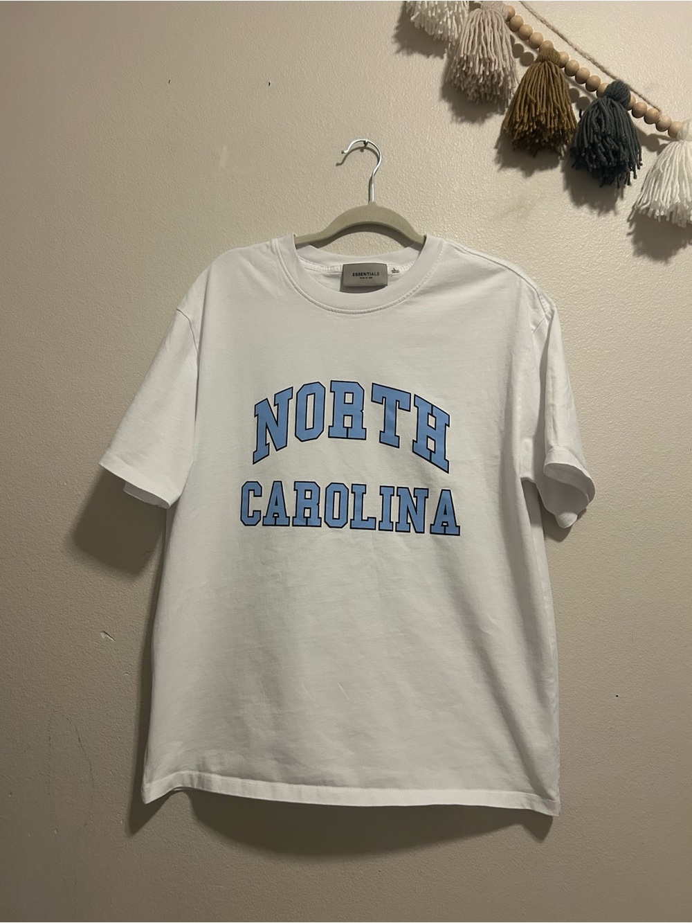 Fear of God White Short Sleeve Tee with Light Blue Collegiate Print